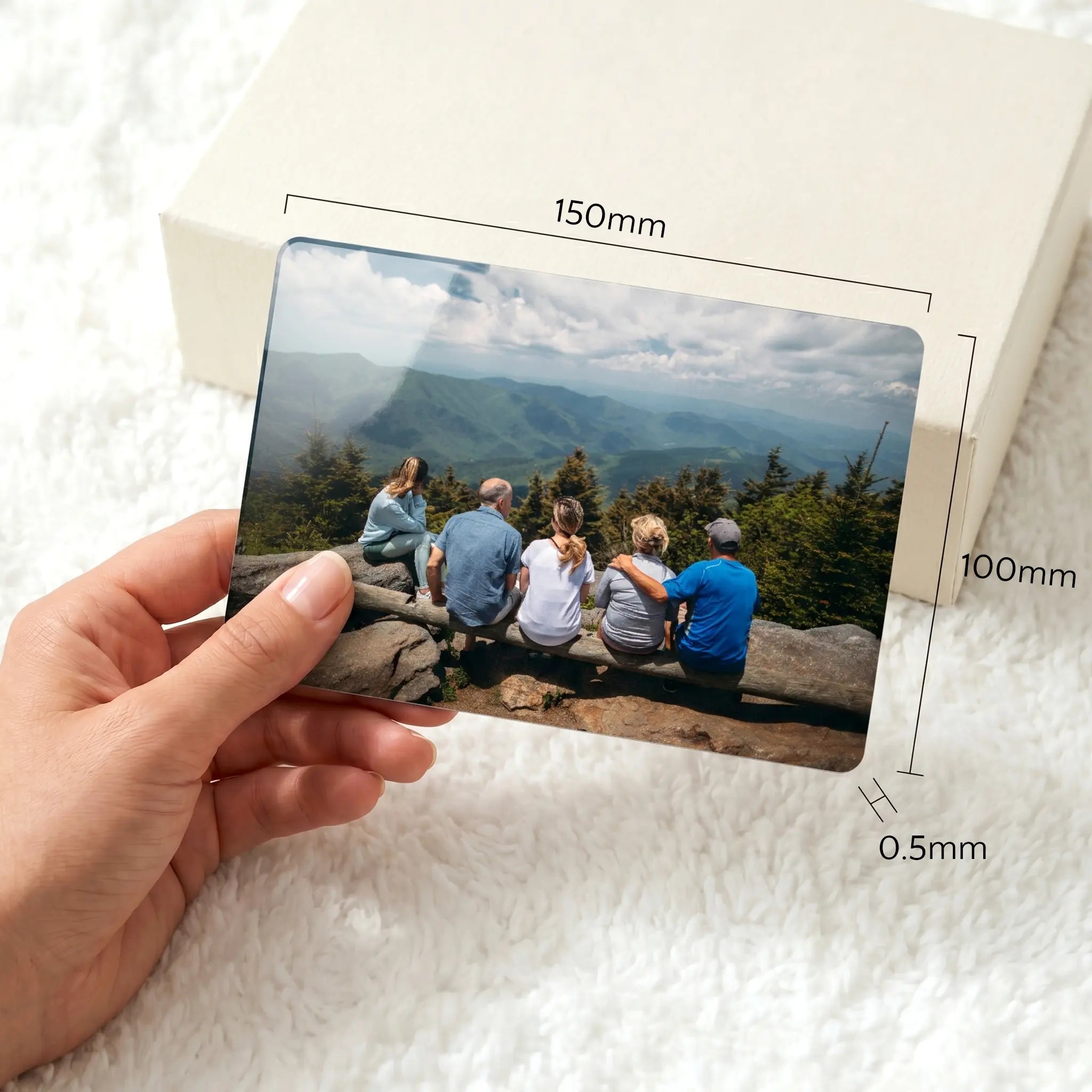 Large personalised aluminium fridge magnet held in hand showing 150mm x 100mm dimensions