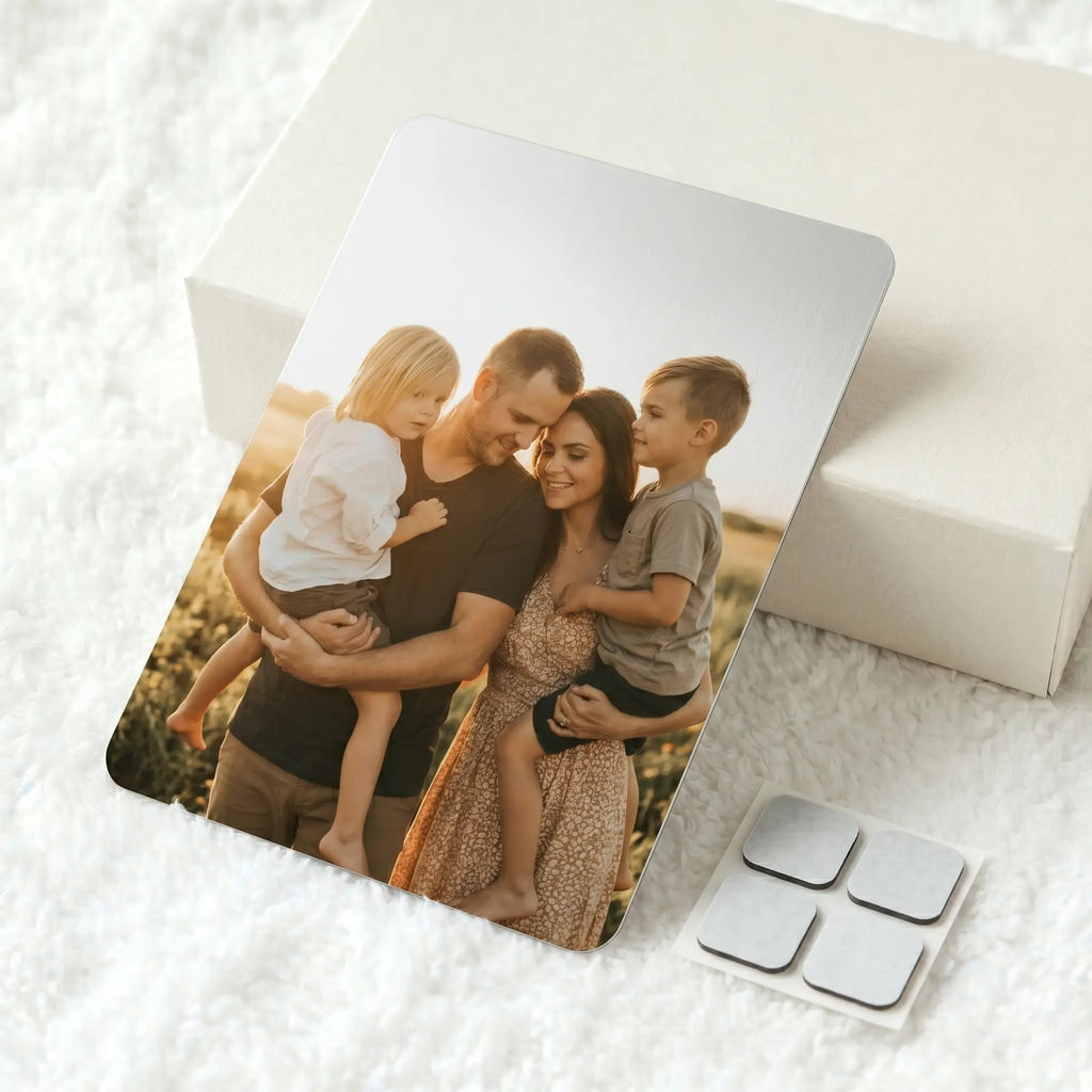 Custom A4 metal photo panel with family portrait print and adhesive hanging pads on soft white textured background