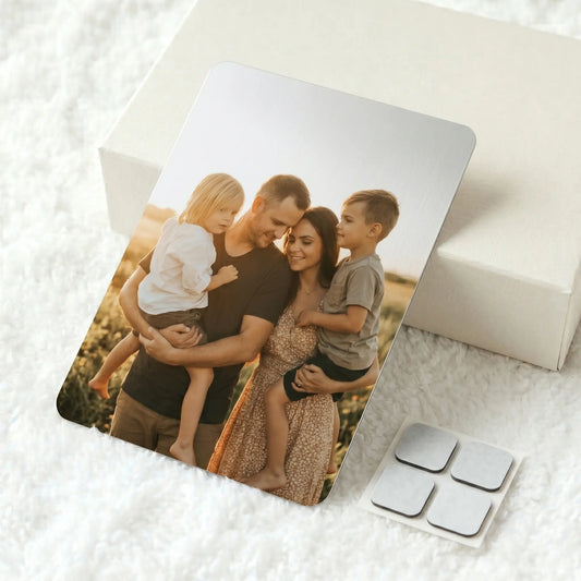 Custom A4 metal photo panel with family portrait print and adhesive hanging pads on soft white textured background