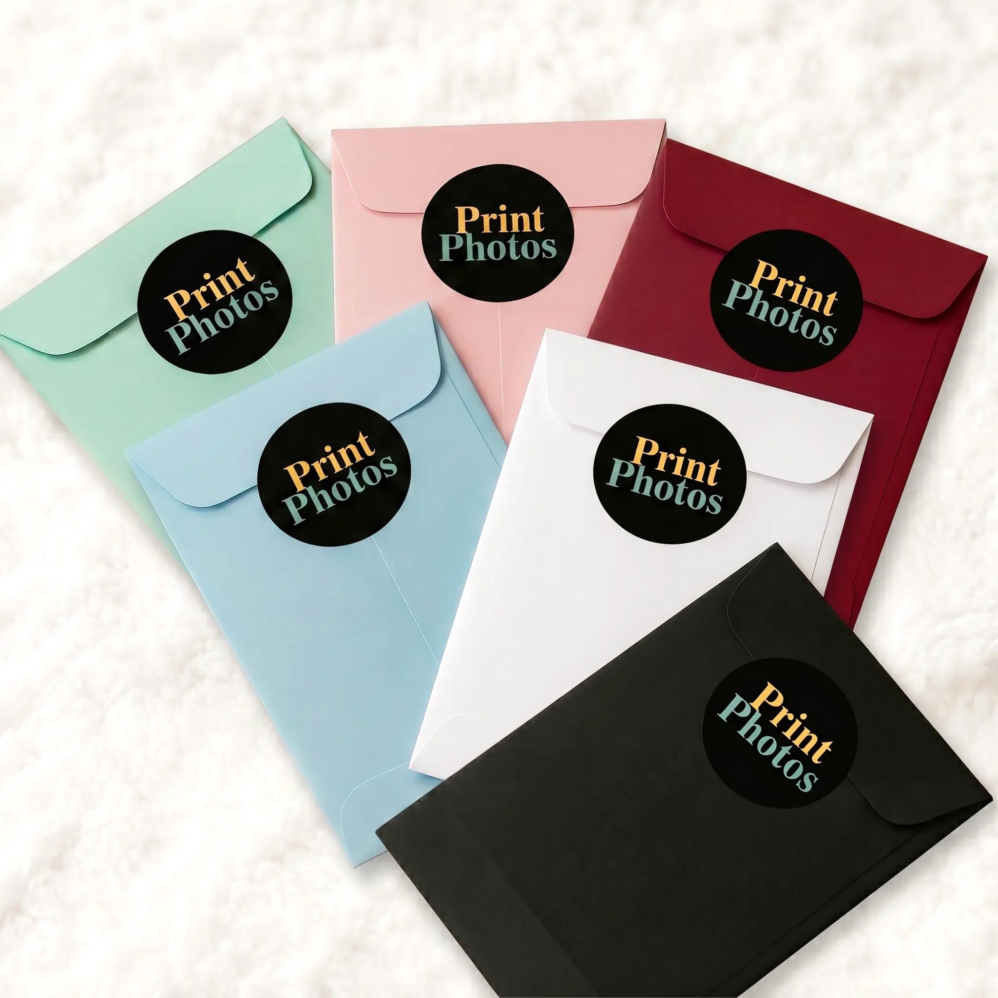 Personalised photo bookmark gift packaging with coloured envelope presentation and Print Photos branded sticker