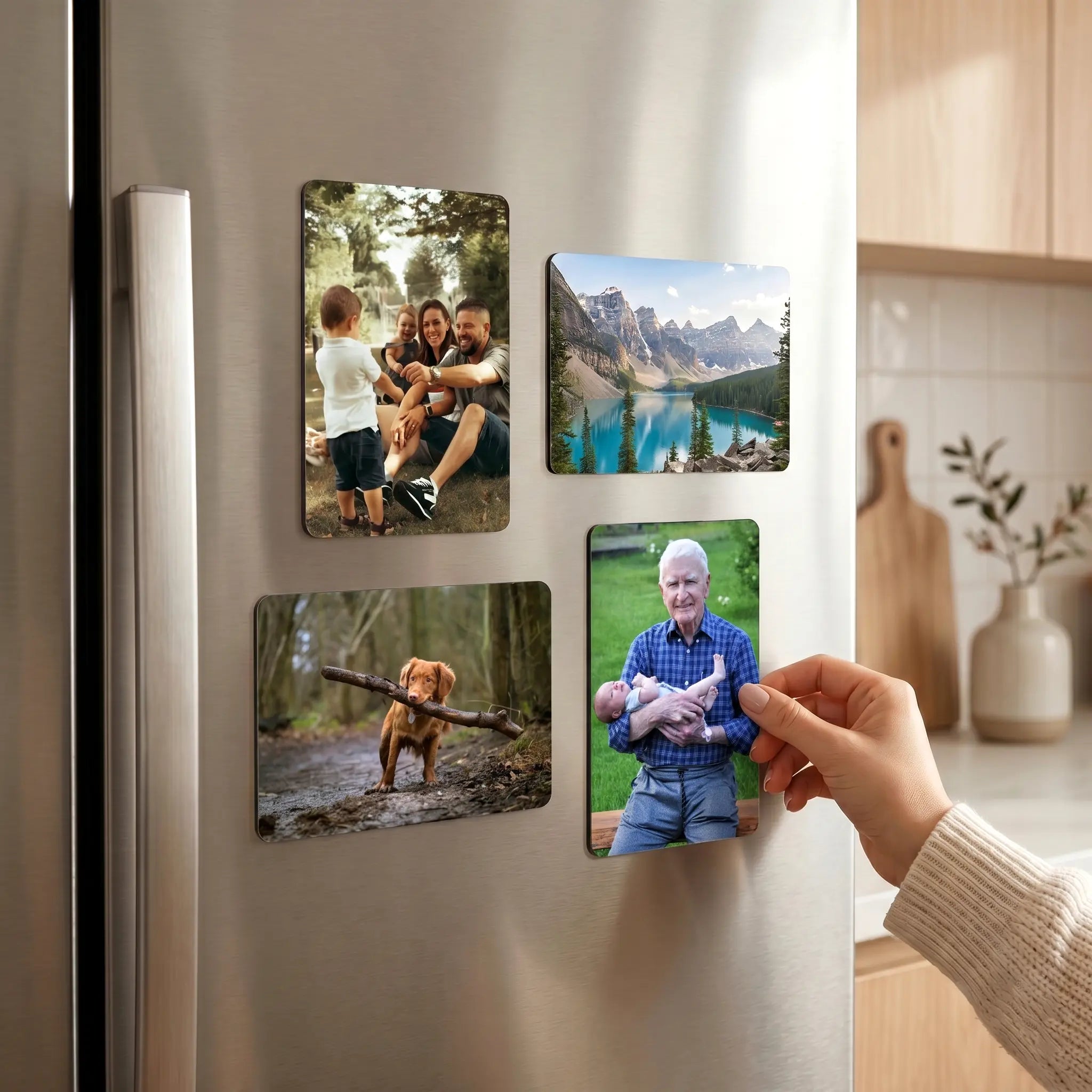 Personalised photo fridge magnets displayed on a modern kitchen fridge in a home setting