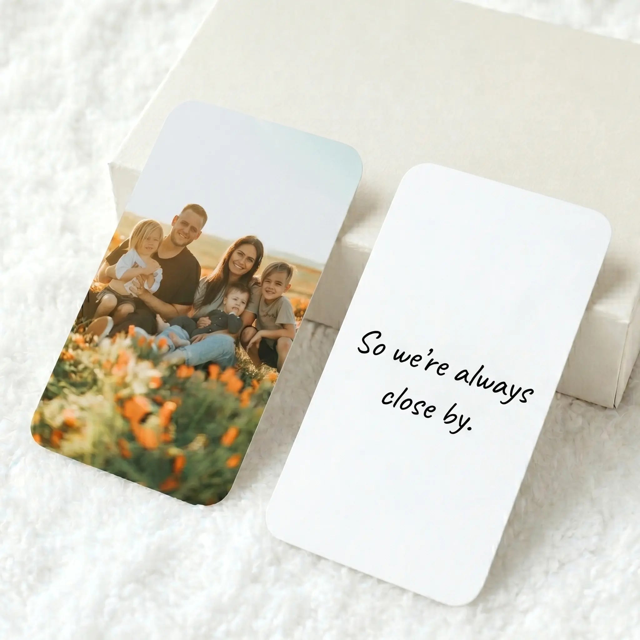 Personalised metal wallet card with custom photo and message, showing double-sided personalisation