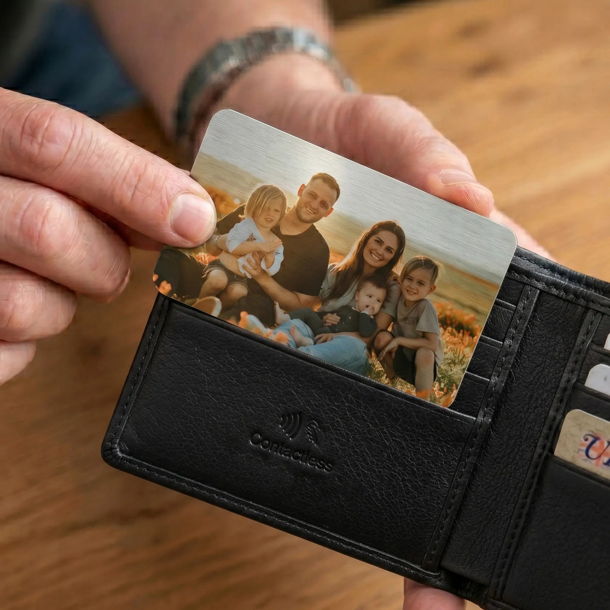 Personalised wallet card displayed inside a black leather wallet as an everyday keepsake gift