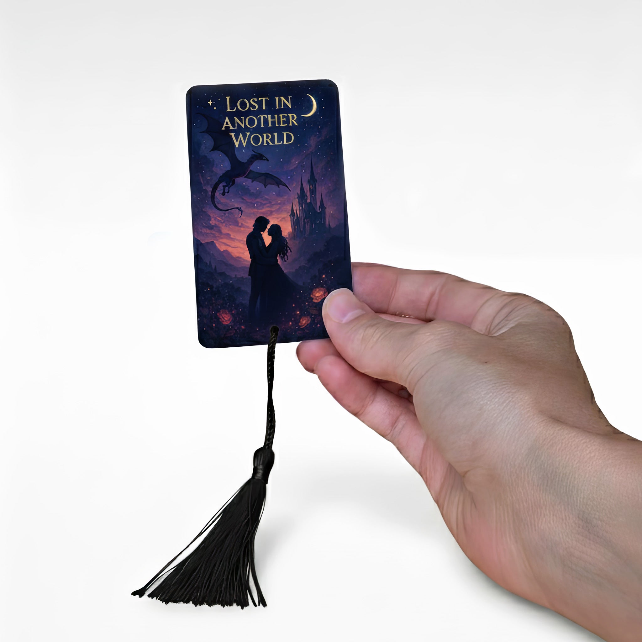 Personalised fantasy metal bookmark with black tassel – romantic silhouette design featuring couple under a dragon and moon with “Lost in Another World” text. Custom aluminium photo bookmark handmade in the UK, ideal fantasy reader or book lover gift.