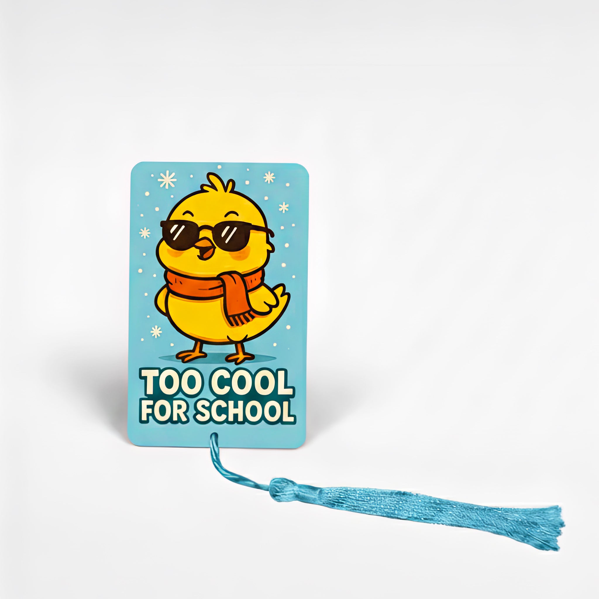 Personalised children’s metal bookmark featuring a yellow chick wearing sunglasses and a red scarf on a blue background with the text “Too Cool for School” – fun custom kids reading gift handmade in the UK.