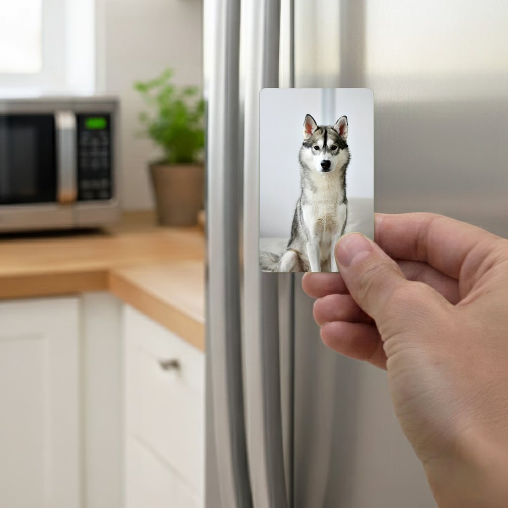 Hand placing personalised husky fridge magnet on kitchen fridge – custom husky owner gift handmade in UK