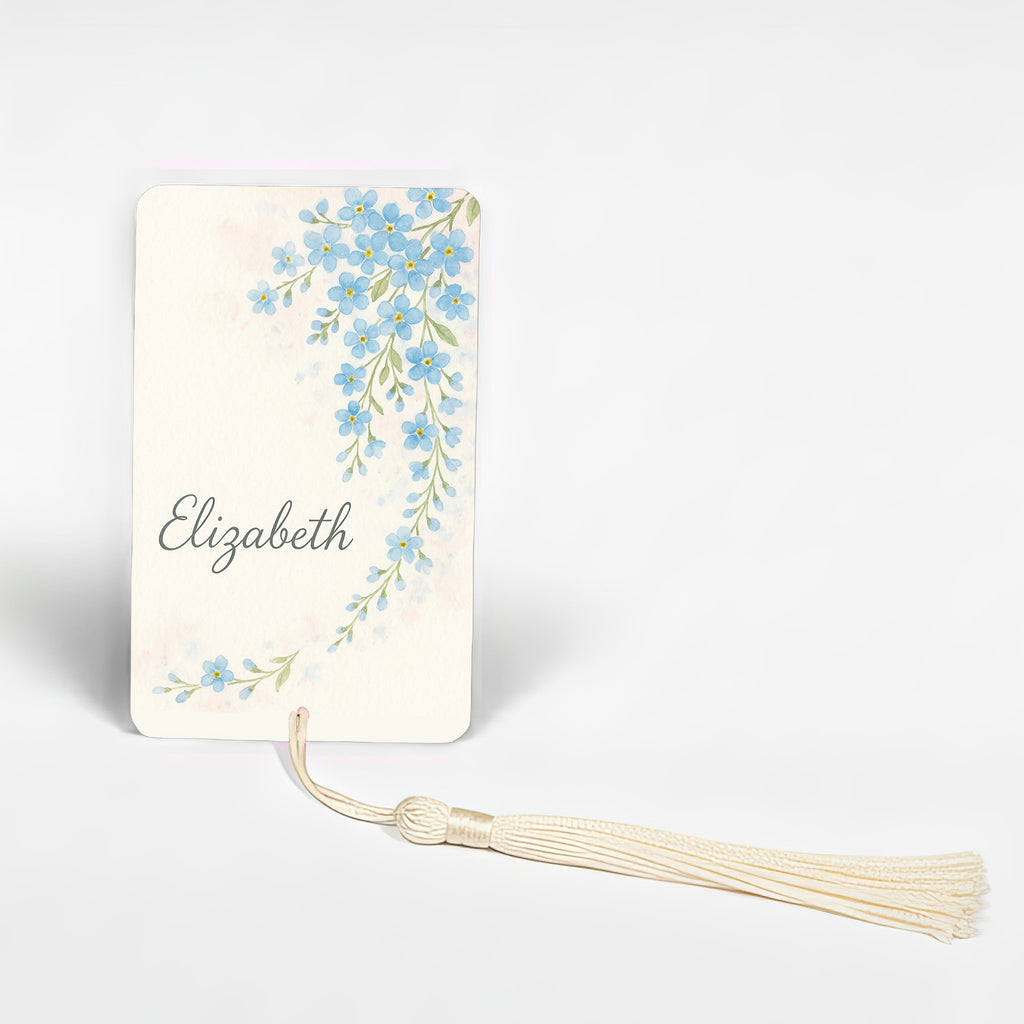 Personalised forget-me-not flower bookmark with name Elizabeth, delicate blue floral watercolour design on premium metal, romantic handmade bookmark made in the UK.