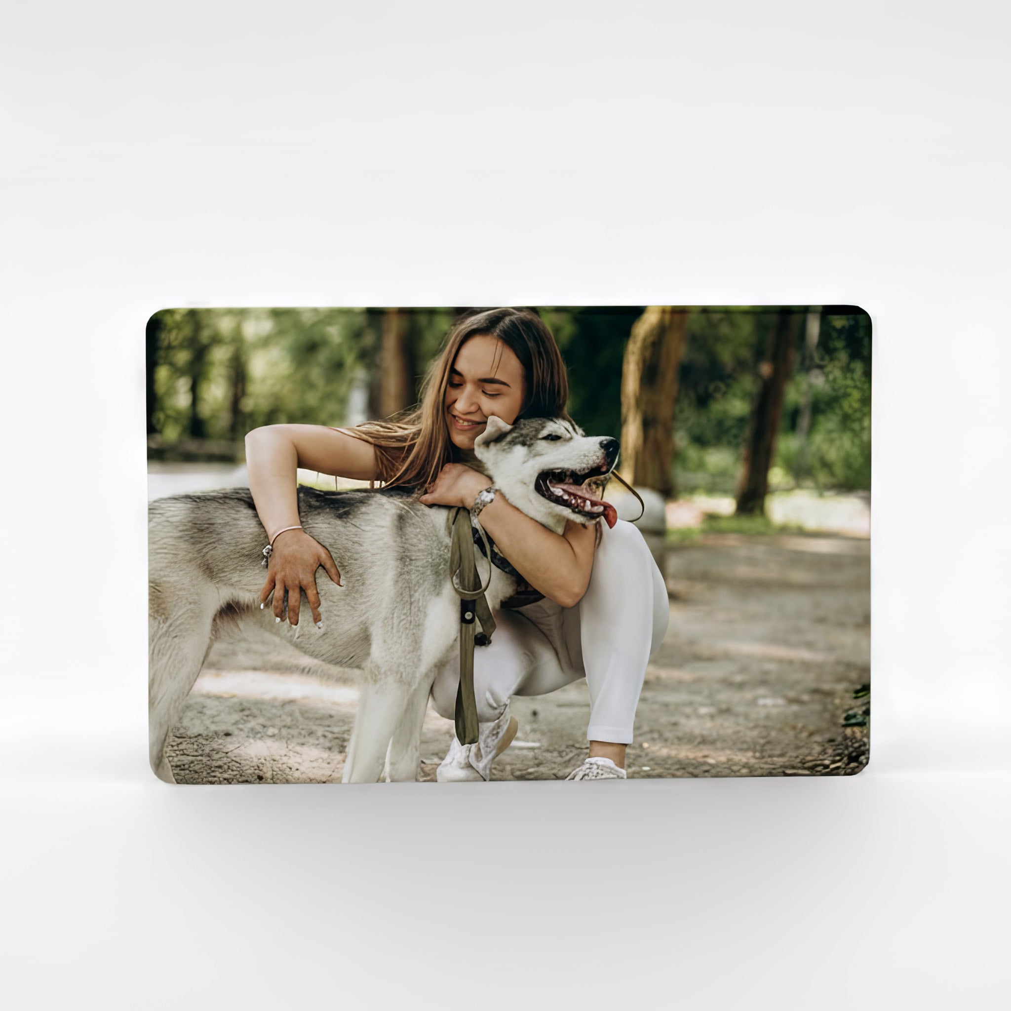 Personalised photo fridge magnet featuring a woman hugging her dog outdoors, printed on premium aluminium — custom picture magnet handmade in the UK.