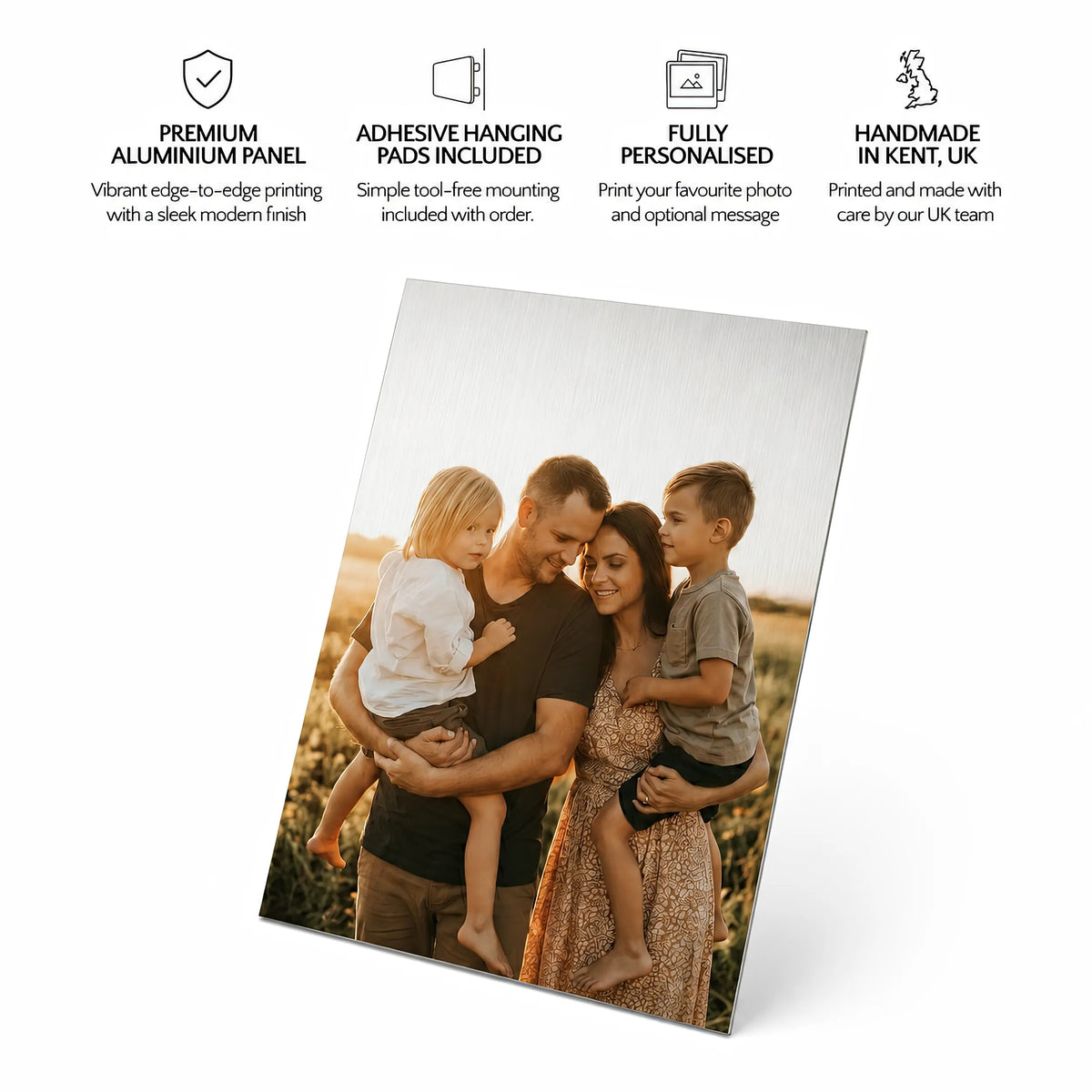 A custom aluminium photo displaying a printed family portrait, shown at an angle on a white background with key feature callout text at the top.