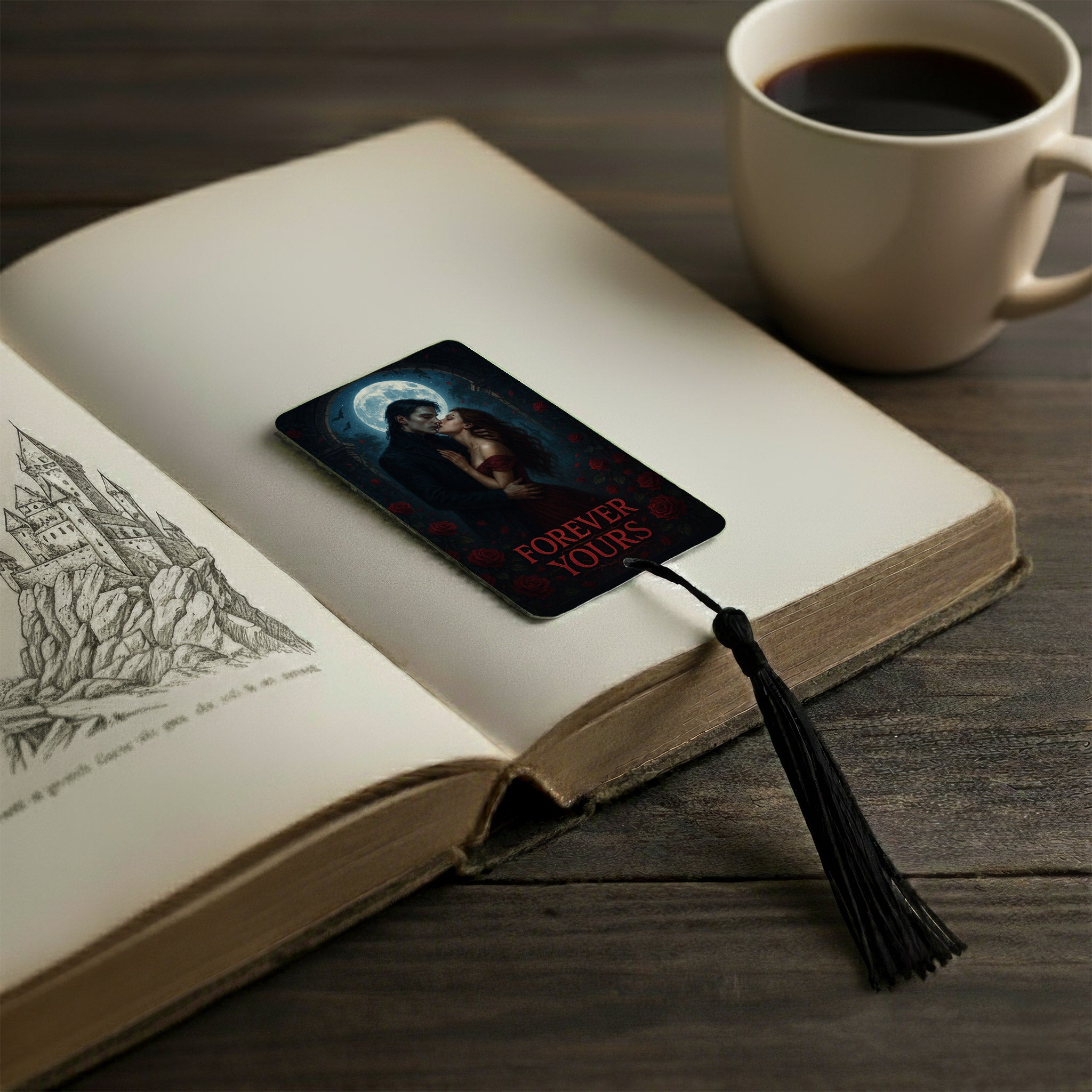 Romantasy themed metal bookmark with dark gothic vampire couple and moonlit background reading ‘Forever Yours’, resting inside an open fantasy novel beside a cup of coffee on a wooden table. Handmade in the UK, this BookTok inspired aluminium bookmark features a black tassel and dramatic romantasy aesthetic — perfect for fantasy romance readers and book lovers.