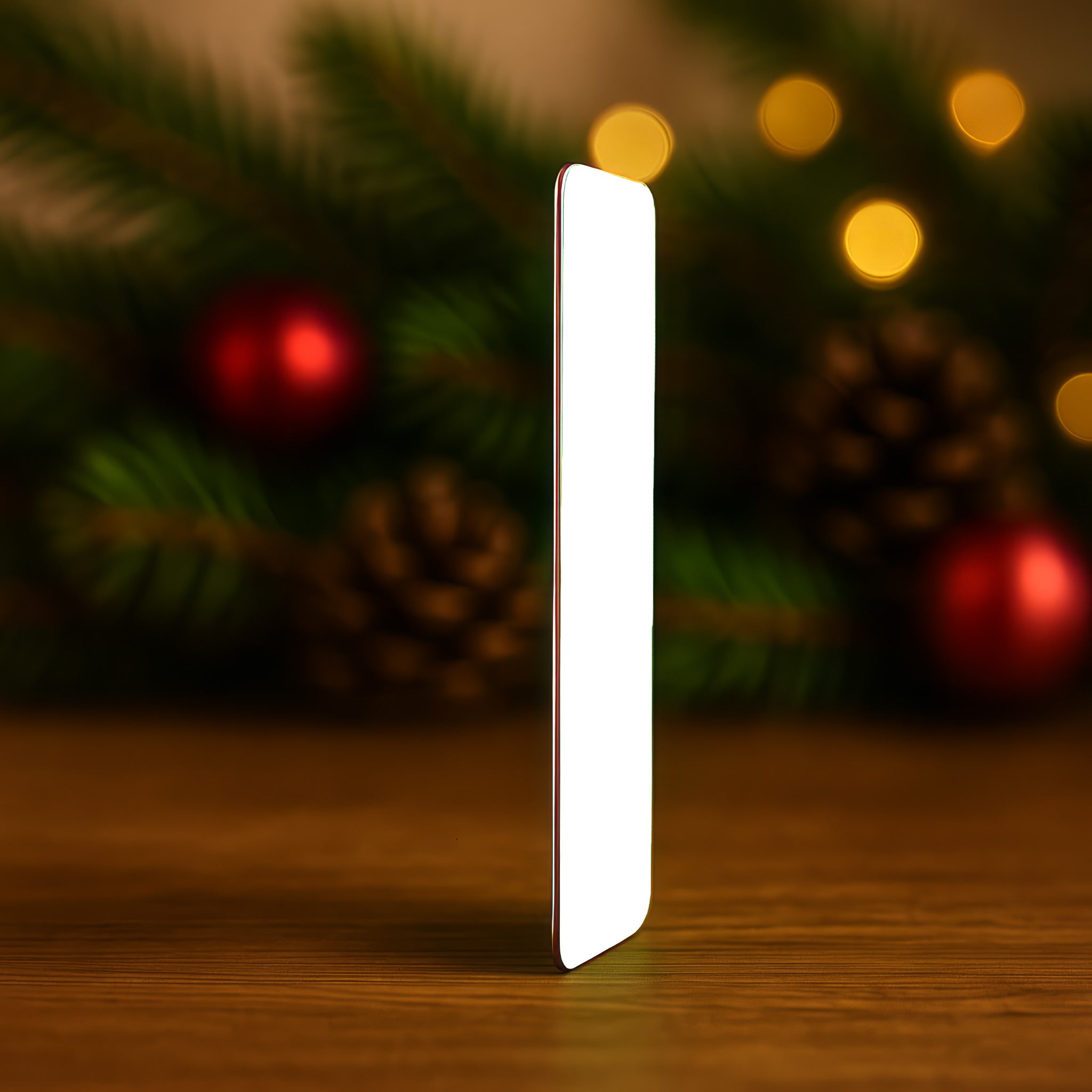 Slim metal wallet card shown edge-on to highlight premium thickness and finish — durable aluminium Christmas keepsake for boyfriend or husband.